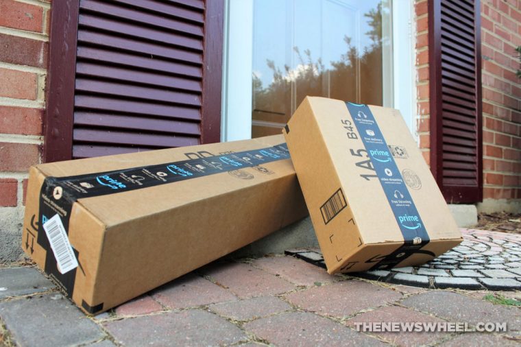 Amazon delivery boxes sitting on a porch outside a front door