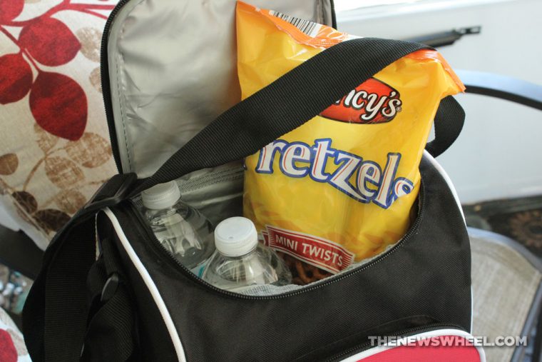 lunch bag with water bottles and a bag of pretzels