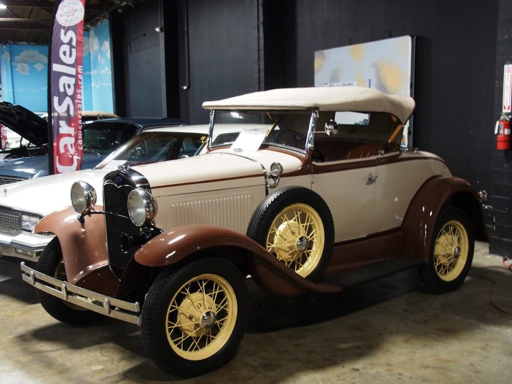 A white Ford Model A Roadster