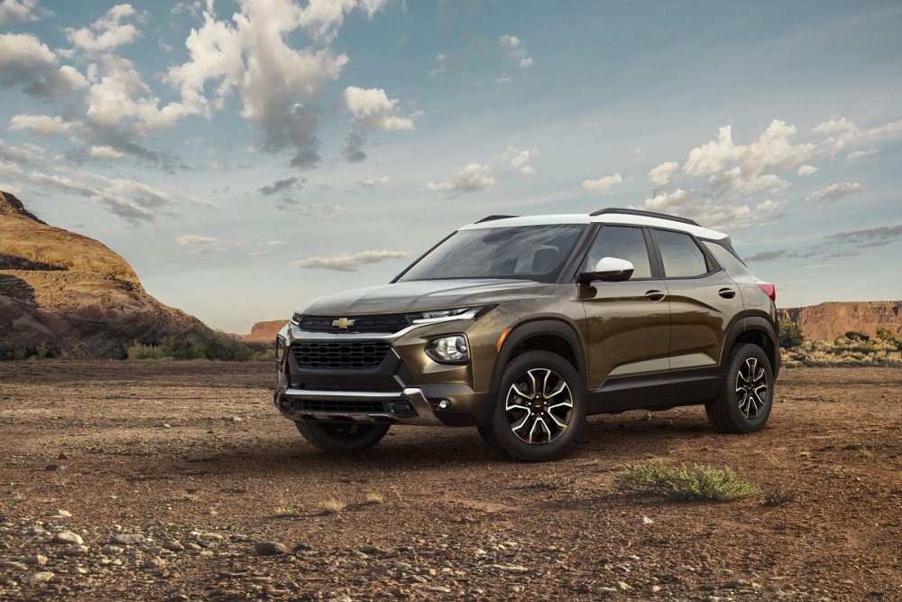 Front side view of 2021 Chevrolet Trailblazer ACTIV parked on rough ground with rock formations in background