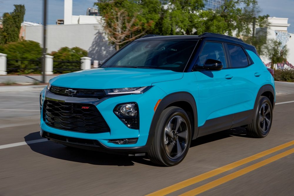 Front side view of blue 2021 Chevrolet Trailblazer RS driving down street