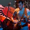 Sufjan Stevens playing Banjo while wearing wings for some reason