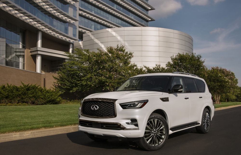2021 INFINITI QX80 in front of modern architecture