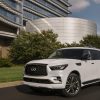 2021 INFINITI QX80 in front of modern architecture