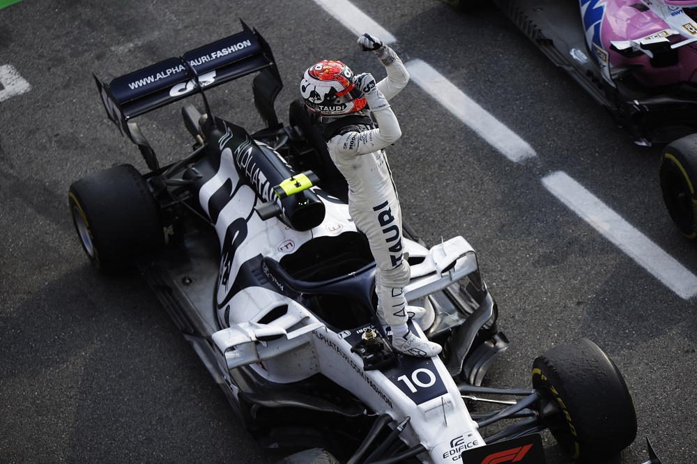 Gasly steps on his AlphaTauri as he celebrates winning the 2020 Italian Grand Prix