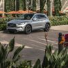 2021 INFINITI QX50 parked in front of an outdoor dining area