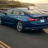 Blue 2021 Chevrolet Malibu cruising down the highway