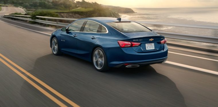 Blue 2021 Chevrolet Malibu cruising down the highway