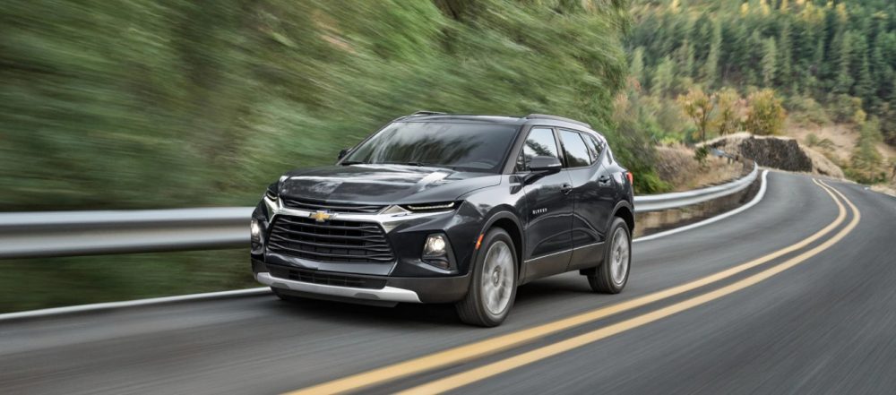 2021 Chevrolet Blazer driving on a winding wooded road