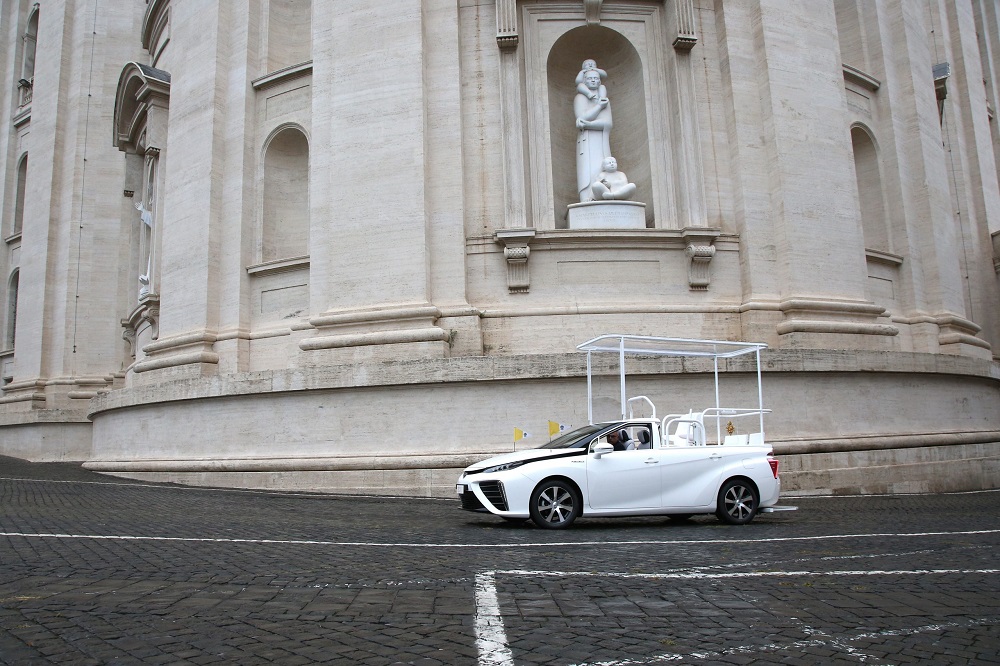 Toyota Mirai Popemobile below statue