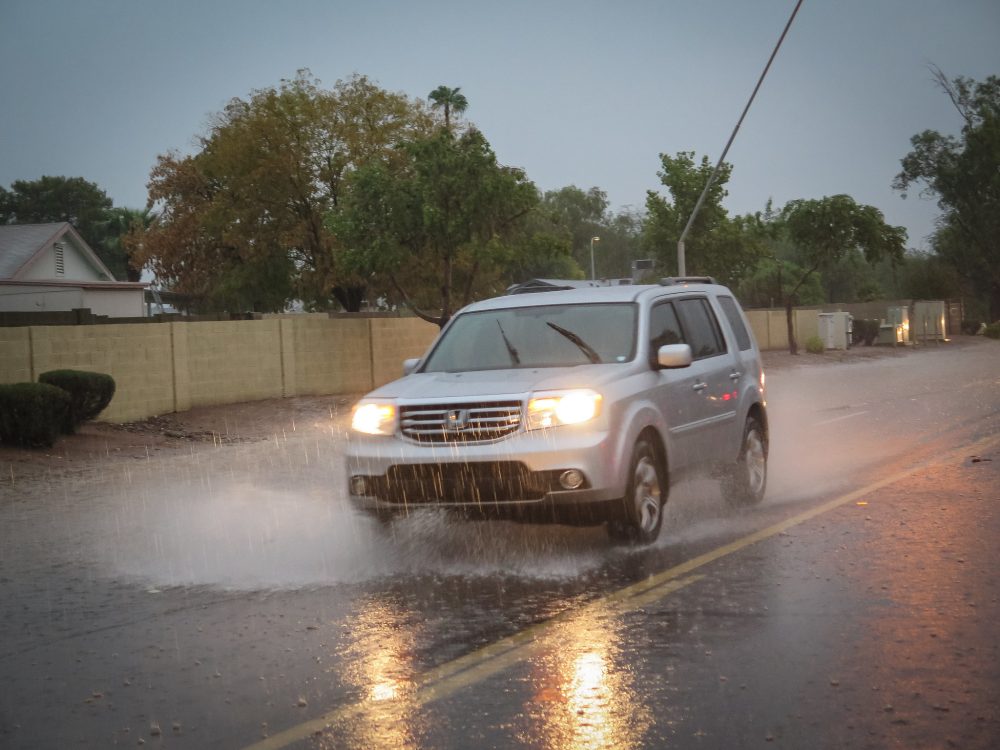 flooding rain tropical storm monsoon car vehicle