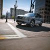 2021 Nissan Rogue driving on city streets