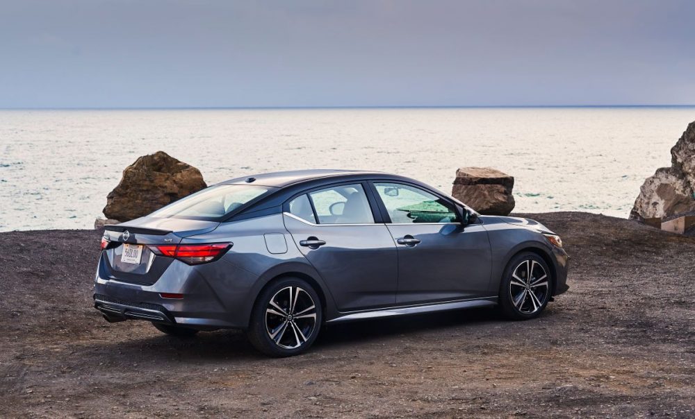 Sideview of 2021 Nissan Sentra parked overlooking a body of water at dusk