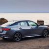 Sideview of 2021 Nissan Sentra parked overlooking a body of water at dusk