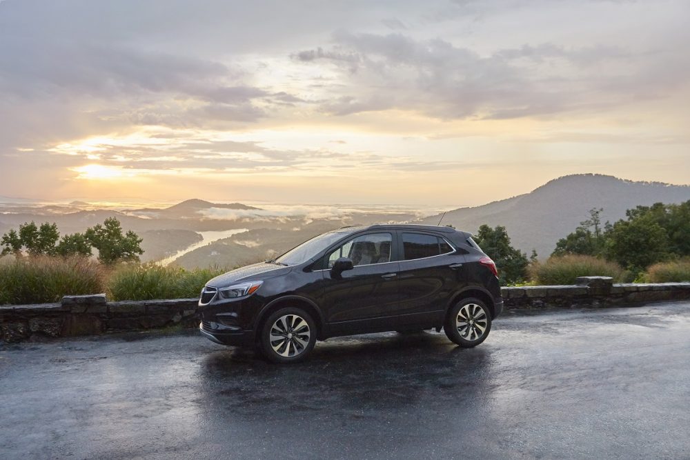 The 2021 Buick Encore parked in front of hills