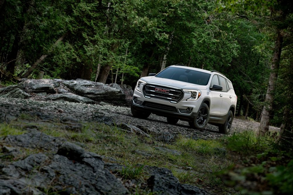 2021 GMC Terrain AT4 driving off-road through a forest