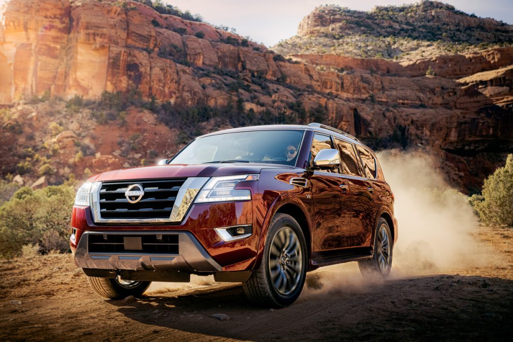 2021 Nissan Armada driving through  a rugged landscape