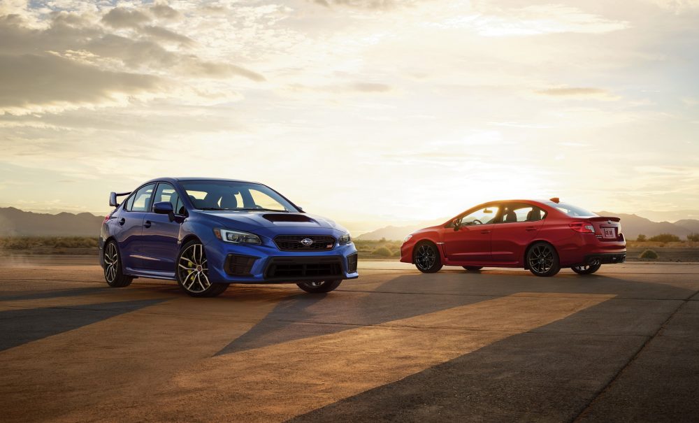 The 2021 WRX and WRX STI, set to a lovely sunset