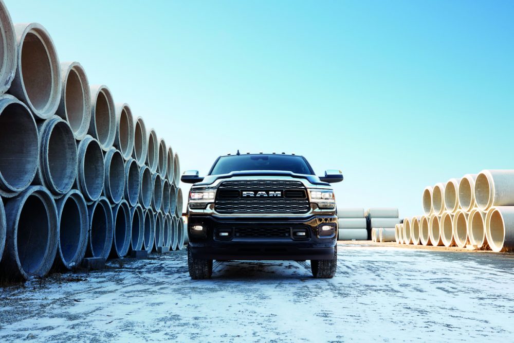 The 2021 Ram 2500 by piles of pipes