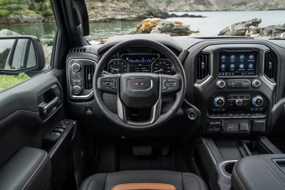 The steering wheel, dashboard, and infotainment system of the 2020 GMC Sierra 1500 AT4