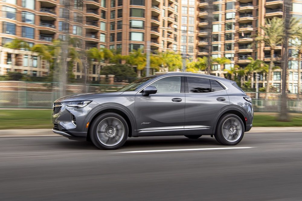 The 2021 Buick Envision Avenir driving down a city street