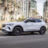 Side view of 2021 Buick Envision driving down city street