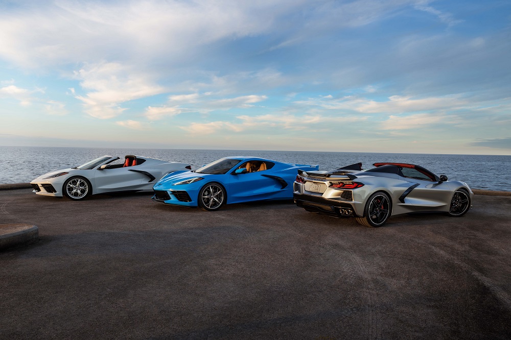 A blue 2021 Chevrolet Corvette Stingray Coupe parked between two silver Chevrolet Corvette Convertibles