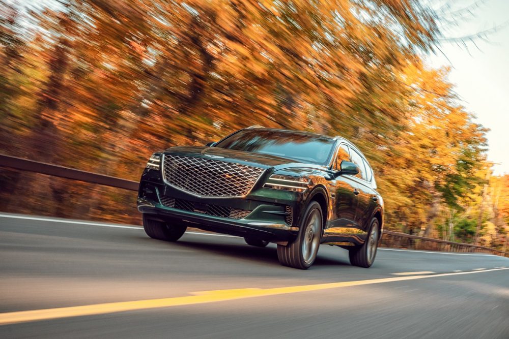 Front view of 2021 Genesis GV80 driving in fall