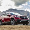 2021 Honda CR-V Hybrid posing dramatically in front of rocky mountains