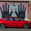 Red 2021 Hyundai Elantra parked in front of mural