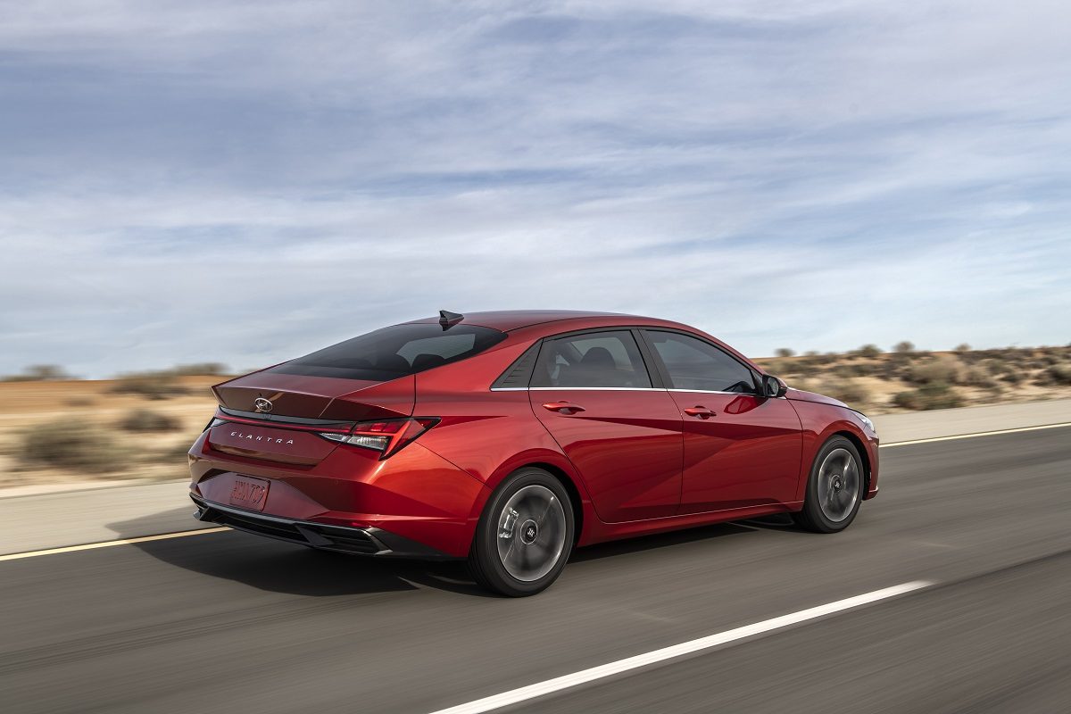 Rear side view of 2021 Hyundai Elantra driving down road