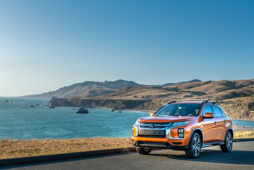 The 2021 Outlander Sport driving by the ocean