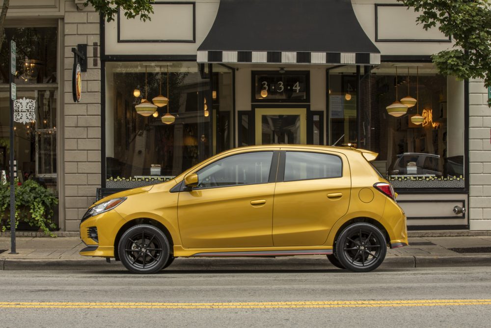 The 2021 Mitsubishi Mirage parked in front of a building