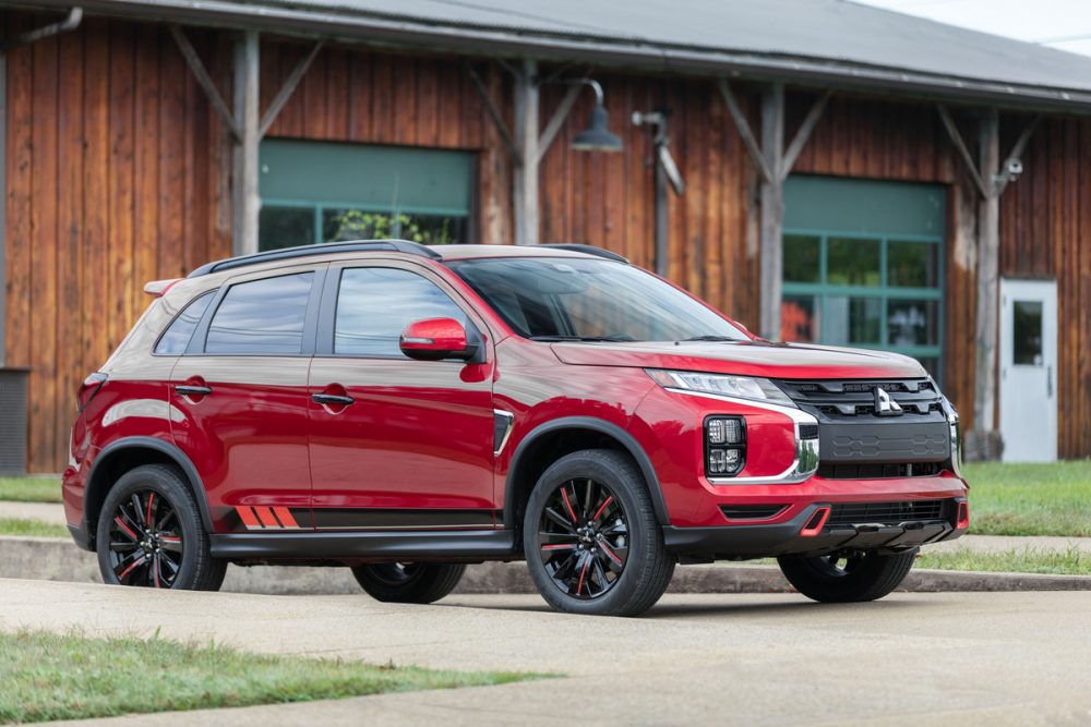 The 2021 Outlander Sport Black Edition in front of a building