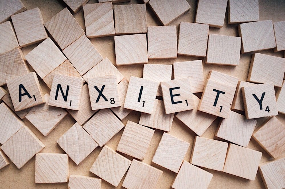 The word "Anxiety" spelled out on wood blocks.