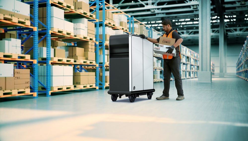 Man using BrightDrop EP1 electric pallet in warehouse