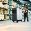 Man using BrightDrop EP1 electric pallet in warehouse