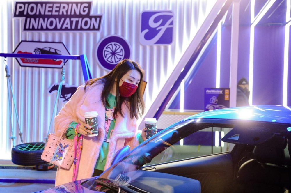 Cool lady checking out Mustang at Ford x Starbucks Pop-Up Beijing