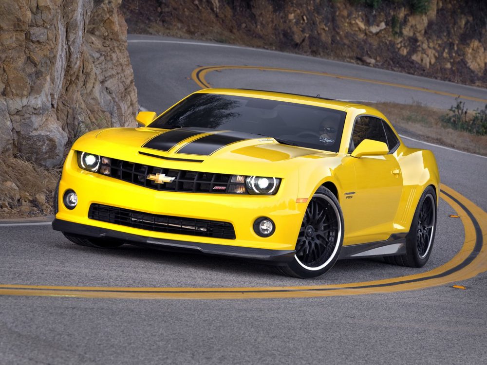 Yellow Chevy Camaro on highway