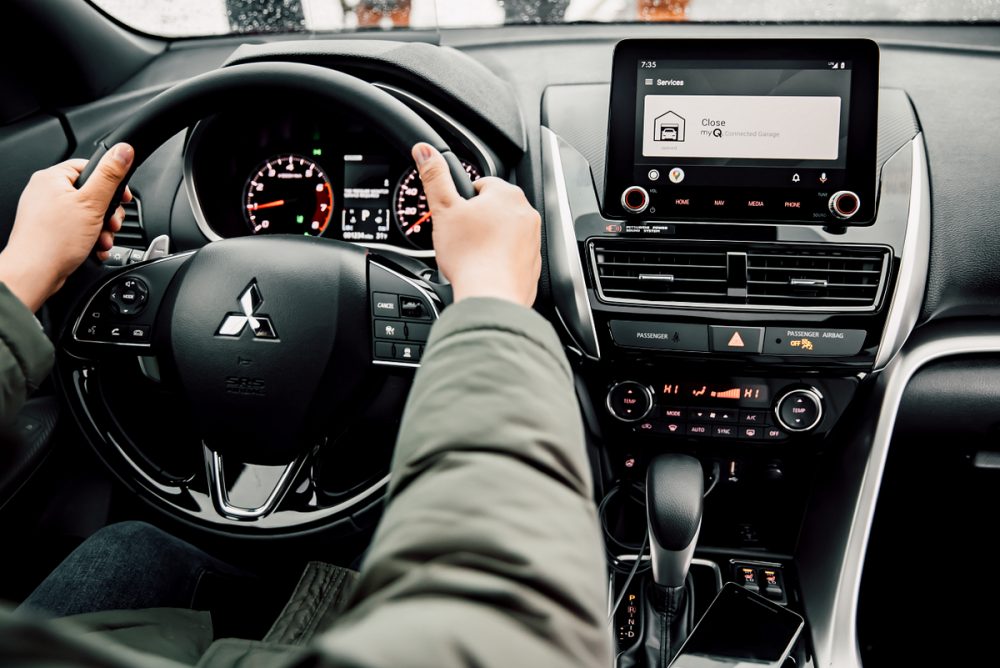 The interior of the the Eclipse Cross, which includes the touch screen with myQ Connected Garage