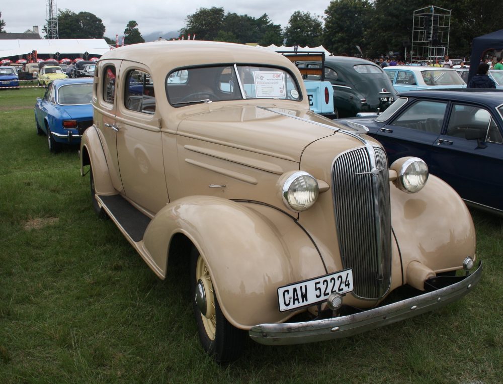 A tan 1937 Chevrolet Standard Four-Door, which is a street-car, but not a streetcar.