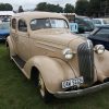 A tan 1937 Chevrolet Standard Four-Door, which is a street-car, but not a streetcar.