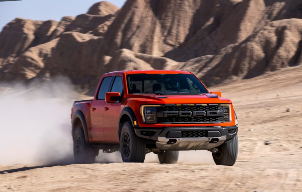 2021 Ford F-150 Raptor kicking up sand in the desert