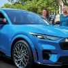 Three women, one of whom is Lori Cichewicz, check out the 2021 Ford Mustang Mach-E
