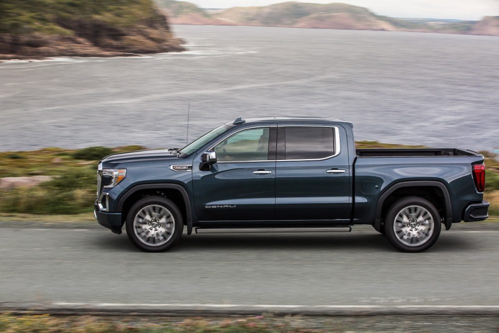 Side view of 2021 GMC Sierra 1500 Denali driving down road