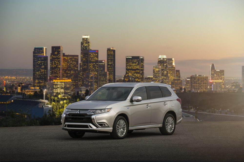 The 2021 Mitsubishi Outlander PHEV in front of a city