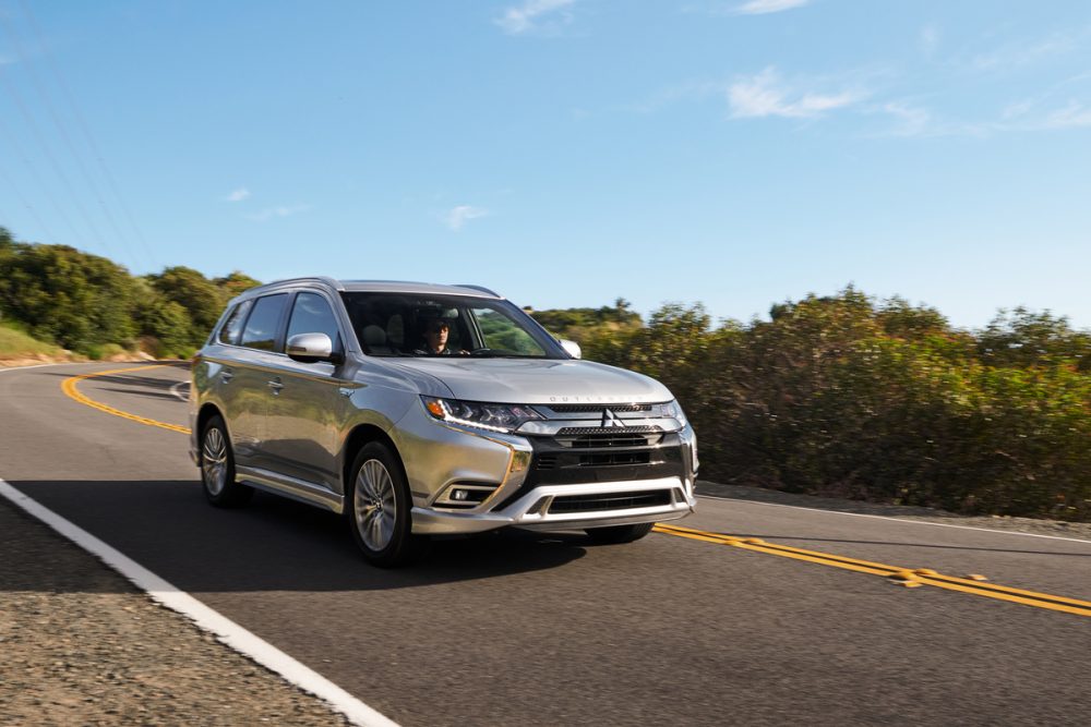 The 2021 Mitsubishi Outlander PHEV driving on the street