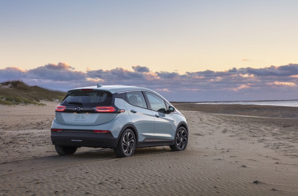 Rear side view of 2022 Chevrolet Bolt EV on beach