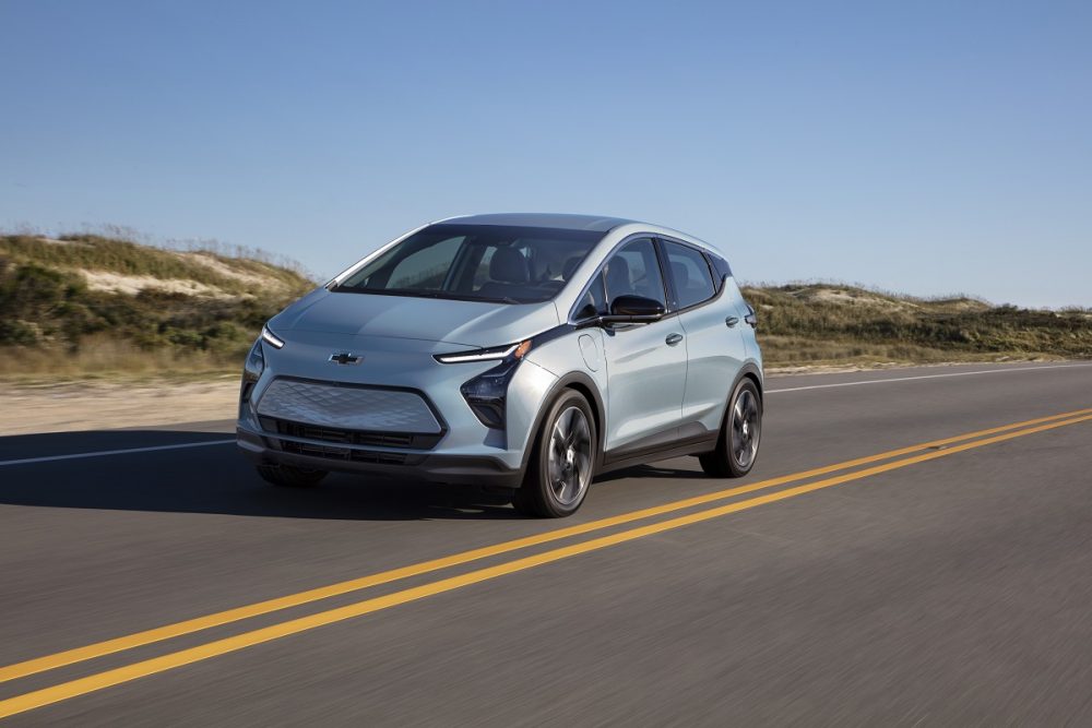 Front side view of 2022 Chevrolet Bolt EV driving down road