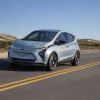 Front side view of 2022 Chevrolet Bolt EV driving down road